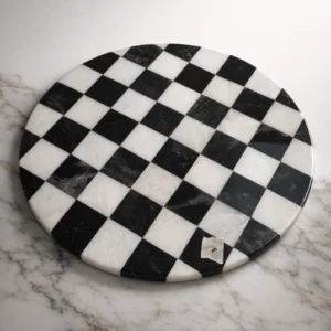 Black and white checkerboard marble round table top